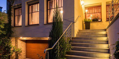 Lighting highlights the curb appeal of a modern home