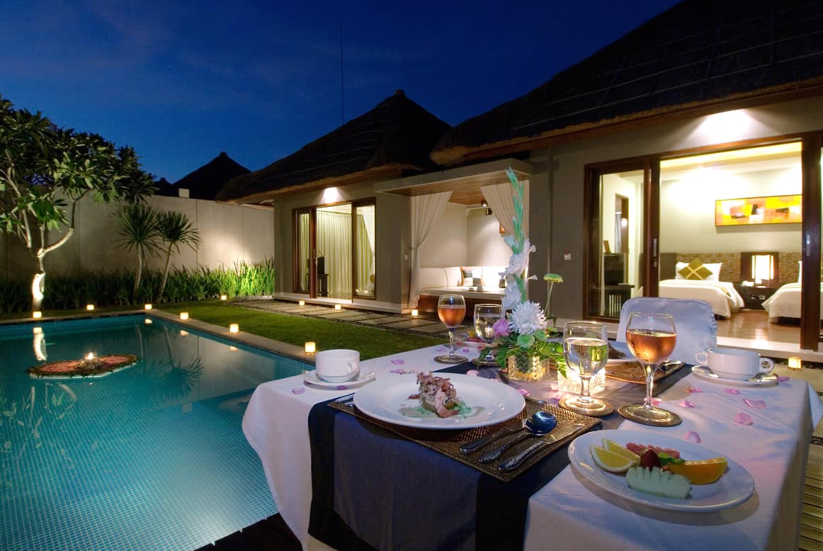 LED Lighting sets the mood around a pool on a perfect evening