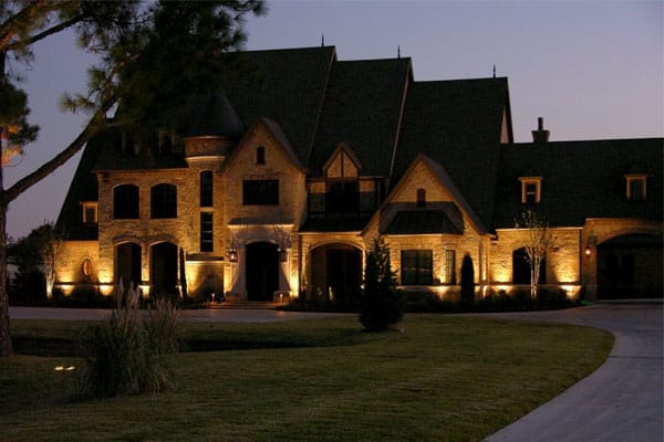 Exterior of large two-story house at night