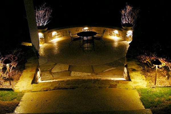 Well-lit garden patio at night