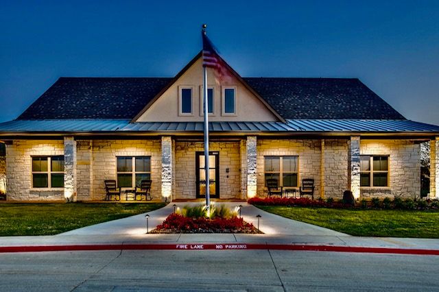 Front view of a well-lit senior living center