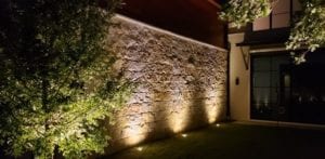 Outdoor lighting of a beautiful stone wall