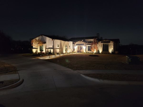 outdoor lighting on a beautiful white house